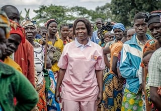 Humanitarian midwife Esther Okunia, trained by UNFPA, with displaced women attending prenatal consultations at the mobile clinic