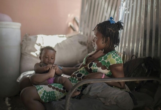 Haiti – Lumilene, 15, lives with her parents and her 6-month-old daughter in a camp for people displaced by the earthquake that