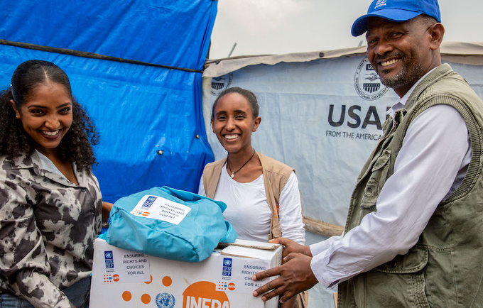 Dignity kit distribution by the Organization for Social Services, Health, and Development, UNFPA and UNDP, at Sabacare 4 camp.