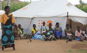 A group of lactating mothers relaxes outside a tent used as a 'safe space’ for women and girls at Mpasa camp in Phalombe, Malawi. Photo: UNFPA Malawi