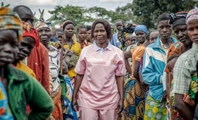 Humanitarian midwife Esther Okunia, trained by UNFPA, with displaced women attending prenatal consultations at the mobile clinic