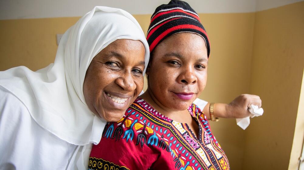 Nurse Salma Mgeni places her arm around Safia Yahya after giving her a contraceptive implant at the Fuoni Health Facility in Zanzibar. For them, it is clear that family planning plays an important role in helping women, families and communities thrive. 