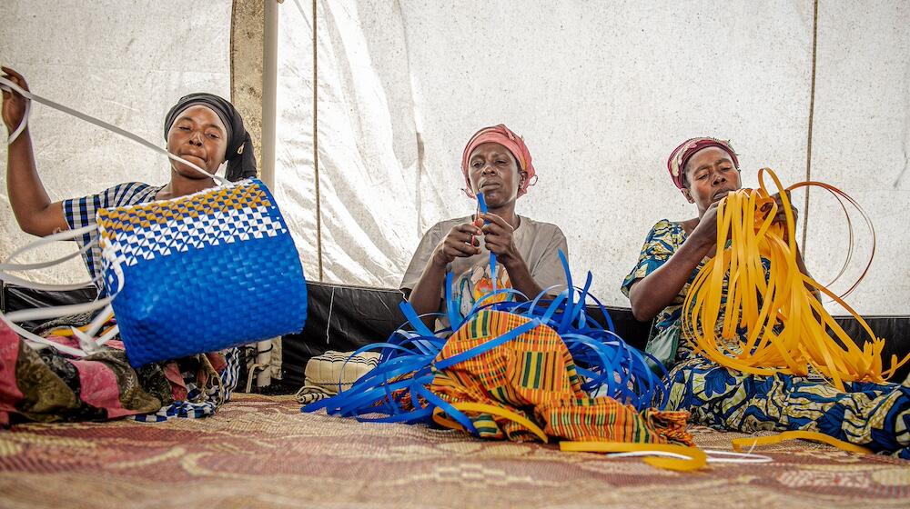 Women learn basket production at a safe space at Bulengo camp for internally displaced persons in North Kivu, DRC.