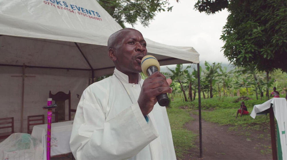 Village health team member Timothy Mbene Masereka shares information about gender-based violence among his community.