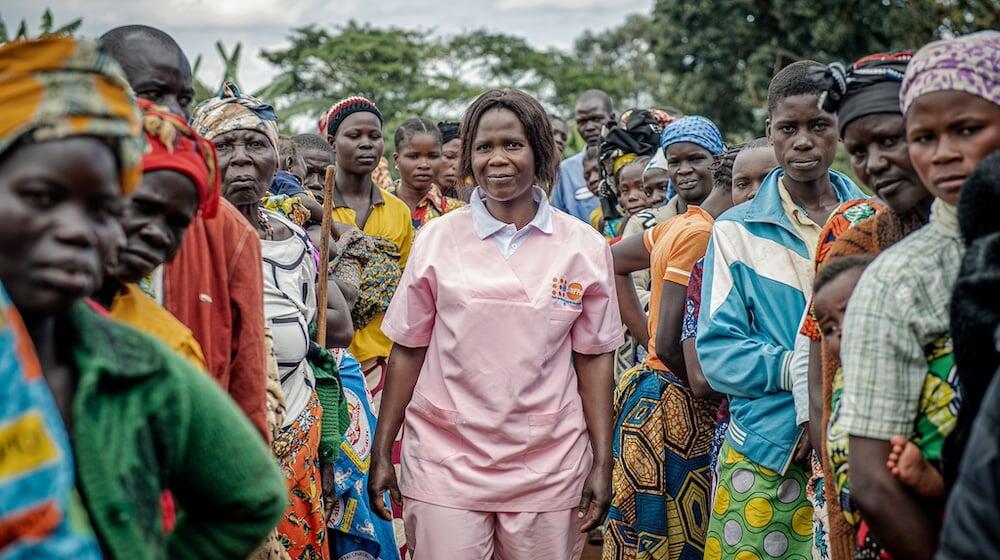 Humanitarian midwife Esther Okunia, trained by UNFPA, with displaced women attending prenatal consultations at the mobile clinic